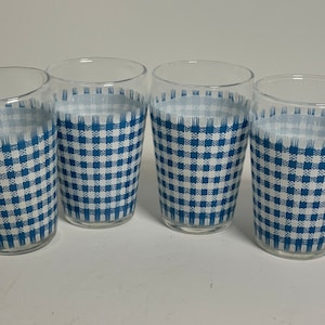 May include: Set of four clear glass tumblers with a blue and white gingham pattern.