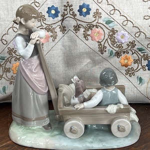 Lladro meisje trekt wagen wagen jongen wagen Lladro beeldje standbeeld collectible vintage Spanje porselein 6959