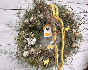 Easter wreath natural hay cork branches with guard eggs in the country house