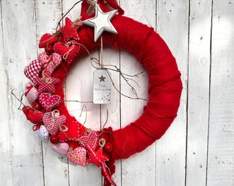 Door wreath red and white Christmas decoration in Scandi style