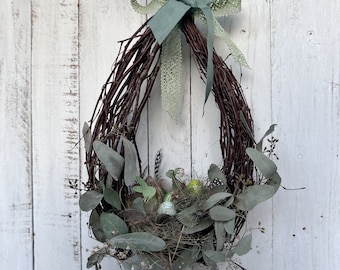 Easter nest door wreath with quail eggs green spring wreath