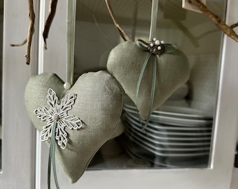 2 hearts made of linen farm green decorative hangers in a vintage look