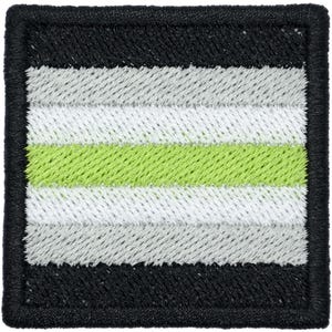 May include: A square embroidered patch featuring a horizontal striped pattern. The design consists of a central lime green stripe flanked by two white stripes, two light gray stripes, and two black outer stripes with a black stitched border.