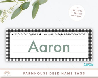 May include: Black and white checkered desk name tag with the name "Aaron" written in green. The tag includes the alphabet in lowercase letters.