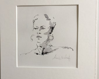 Cara de mujer en pluma y tinta.