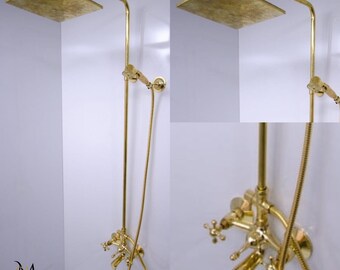 May include: Gold shower head and faucet set with a square shower head and a handheld shower head. The shower head is mounted on a long, straight pipe.
