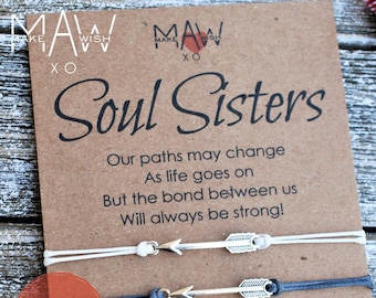 May include: Two friendship bracelets with arrow charms on a card that reads "Soul Sisters" with the text "Our paths may change as life goes on but the bond between us will always be strong!" and "Customize the card".