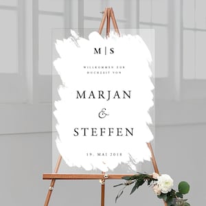 Può includere: Segno da matrimonio in acrilico bianco con pennellate nere e testo. Il cartello recita "M|S Willkommen zur Hochzeit von Marjan & Steffen 19. Mai 2018".