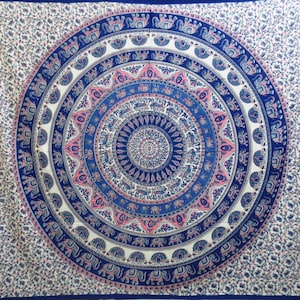 May include: A white tapestry with a blue and pink mandala design featuring elephants. The mandala is surrounded by a border of floral patterns.