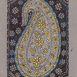 May include: A hand-painted paisley design in grey, yellow, white, and blue. The central paisley shape is filled with floral patterns and outlined with a blue border. The background is dark grey with floral accents.