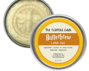 May include: A round, silver tin of Butterbrew Lotion Bar by The Scented Geek. The lotion is a light yellow color and has a bee design embossed on the surface. The label includes the ingredients and company information. Net weight is 2 oz.