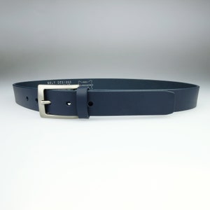 May include: A dark blue leather belt with a silver buckle. The belt has the text "BELT DESIGNS" embossed on the back.