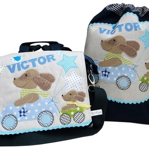 May include: A blue and white backpack and a matching drawstring bag with a dog and car design. The backpack has a name tag that says "VICTOR".