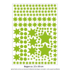 May include: A sheet of green star and circle stickers measuring approximately 22 inches by 30 inches. The text "Bogen ca. 22 x 30 cm" is printed at the bottom of the sheet. The text "(gr&uuml;ne farbe wird nur zur besseren Sichtbarkeit des Bogens verwendet-nicht original Leuchtfarbe)" is printed below the measurement text.