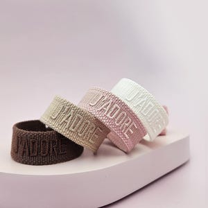 Statement bracelet J'adore bracelet Woven bracelet with tassels Woven bracelet with writing Festival bracelet in boho style Friendship bracelet