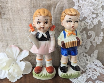 Figurines vintage en céramique garçon et fille