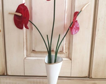 Vintage porcelain vase with artificial flowers