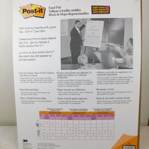 May include: A Post-it Easel Pad package. The white package features the Post-it logo, product information in English, French, and Spanish, and a photo of a presentation. The package includes self-stick sheets and bleed-resistant paper.