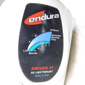 May include: White Endura device with a black panel featuring the brand logo and a blue and white speed indicator. Text includes "ENDURA 50" and "50 LBS THRUST". Made in USA.