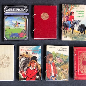 Cuaderno elaborado a partir de una novela antigua con 50 páginas en blanco: utilizable como diario creativo.