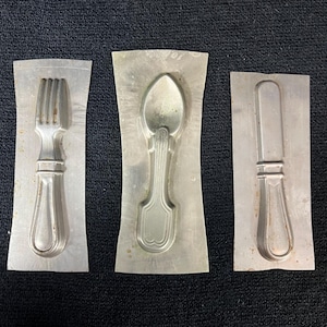 May include: A handmade wooden sign with the text "Welcome" in a handwritten style. The sign is painted white with a distressed finish, and a small green leaf is attached to the top. The sign measures approximately 12 inches wide.