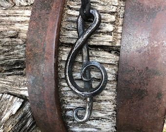 Hand forged treble clef pendant