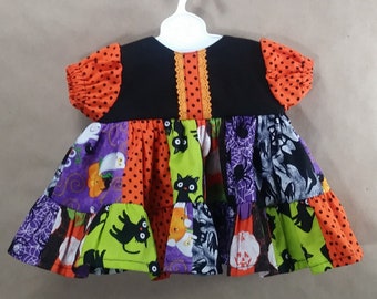 Halloween dress fits 13-15 inch dolls. like cabbage patch and bitty baby.