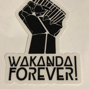 May include: Black and white sticker with a raised fist and the text "Wakanda Forever!"