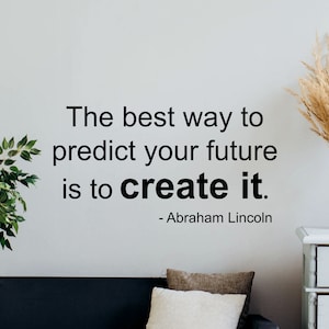 May include: A black and white inspirational quote on a white wall. The quote reads "The best way to predict your future is to create it." - Abraham Lincoln.