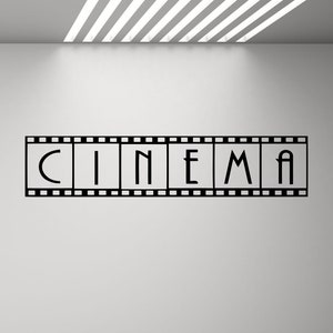 Könnte beinhalten: Schwarz-weißer Filmstreifen mit dem Wort "KINEMA" in der Mitte.