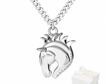 May include: A silver-colored horse head pendant necklace with a curb chain. The horse head pendant has a detailed mane and is adorned with small, sparkling accents. A white gift box with a ribbon is in the background.