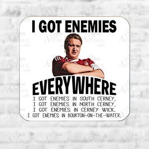 May include: Square coaster with the text "I GOT ENEMIES EVERYWHERE" above and below an image of a man. Additional text lists locations: South Cerney, North Cerney, Cerney Wick, and Bourton-on-the-Water.
