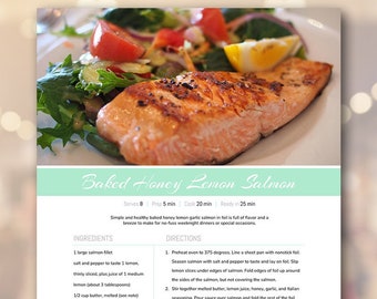 May include: A printable recipe card for Baked Honey Lemon Salmon. The recipe card includes a list of ingredients, directions, and notes. The image shows a salmon fillet on a bed of greens and tomatoes.