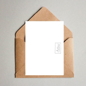 May include: A blank white card with a brown envelope. The card has a small black and white logo in the bottom right corner that says "Andren Illustrations".