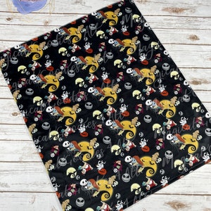 May include: Black blanket featuring a repeating pattern of characters from The Nightmare Before Christmas. The design includes Jack Skellington, Sally, Zero, and other Halloween-themed elements. The blanket has the text "Magical Goodies 4 All Etsy" at the bottom.