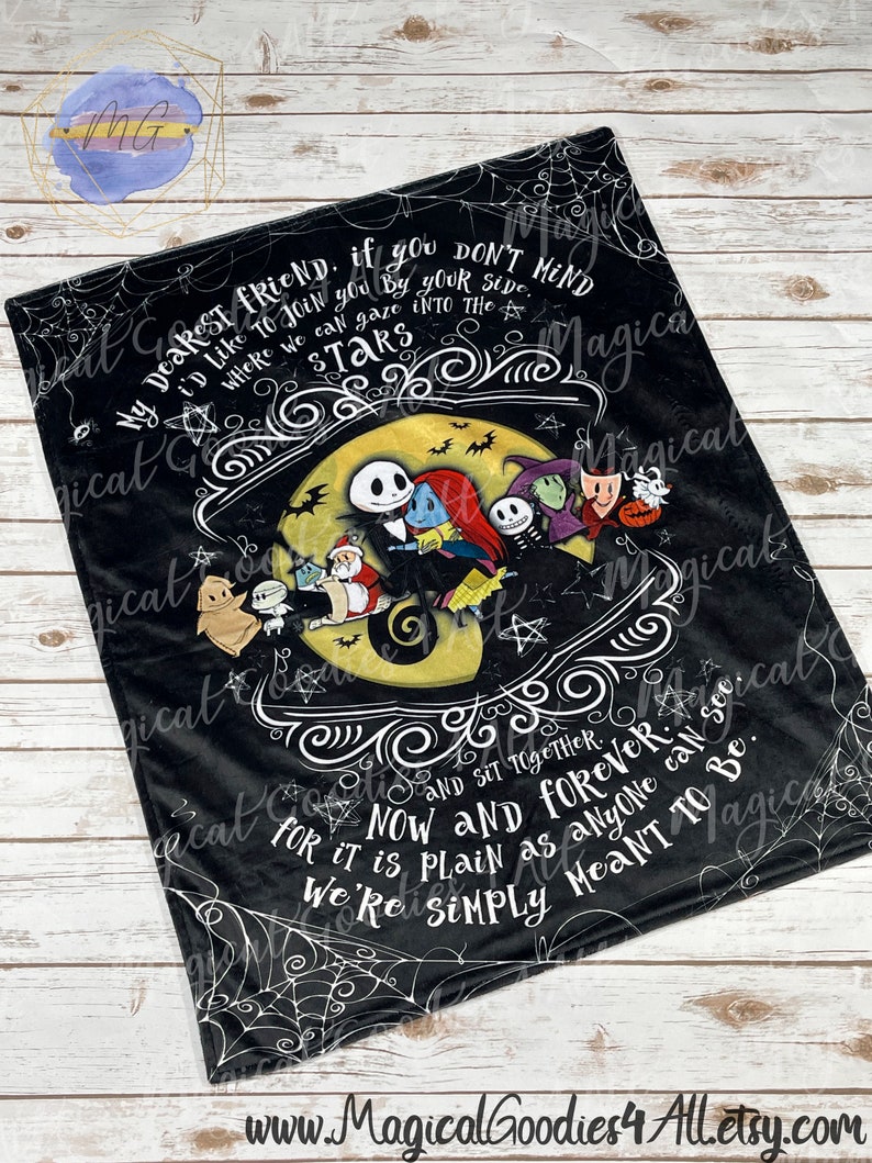 May include: Black plush blanket featuring characters from The Nightmare Before Christmas. The blanket has a central design with Jack Skellington, Sally, and other characters in front of a yellow moon. Text includes "My dearest friend..." and "Now and forever."