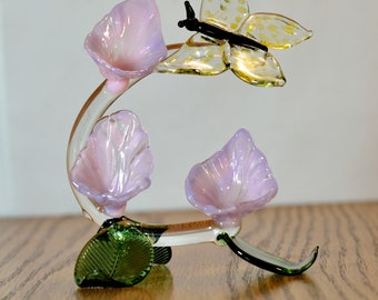 hand blown glass flowers with a butterfly