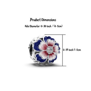 May include: A silver charm with a flower design. The flower has a red and white center with blue petals. The charm is 0.59 inches (1.5 cm) in diameter, with a hole diameter of 0.20 inches (0.5 cm).
