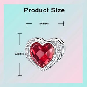 May include: A silver heart-shaped charm with a large, faceted red gemstone center. The charm is 0.43 inches wide and 0.48 inches tall, with a border of small, clear crystals. The text "Product Size" is at the top.