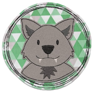 May include: A gray wolf with a black nose and fangs, with a green and white geometric pattern background. The wolf is inside a black circle with a white outline.