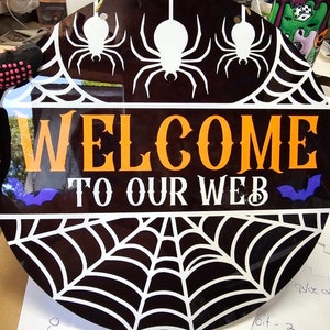 spider web welcome sign