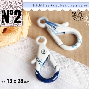 2 pretty key carabiners - the metal white lacquered with various blue random patterns - ø each about 13 x 28 mm - No. 180