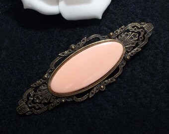 Vintage broche zalmkleurig en messingkleurig, cabochon broche, troep ding erbij