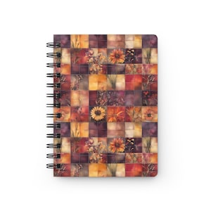 May include: Spiral-bound notebook featuring a colorful, tiled design with floral and botanical elements in shades of orange, yellow, and purple. The cover has a grid pattern with various flowers and plants.