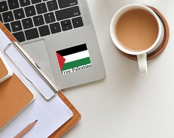 May include: A laptop computer with a sticker on the top right corner. The sticker features the Palestinian flag and the text "Free Palestine".