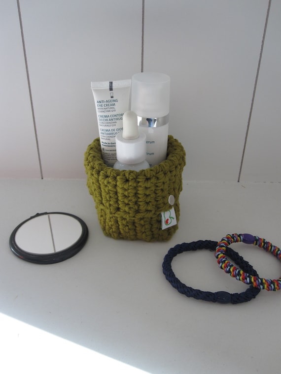 Crochet basket made of organic cotton yarn in olive green