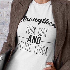 May include: White t-shirt with the text "Strengthen your core and pelvic floor" in black.