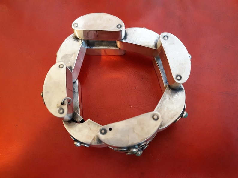 Hollow Geometric Silver Bracelet with Turquoise Accents is made in Mexico