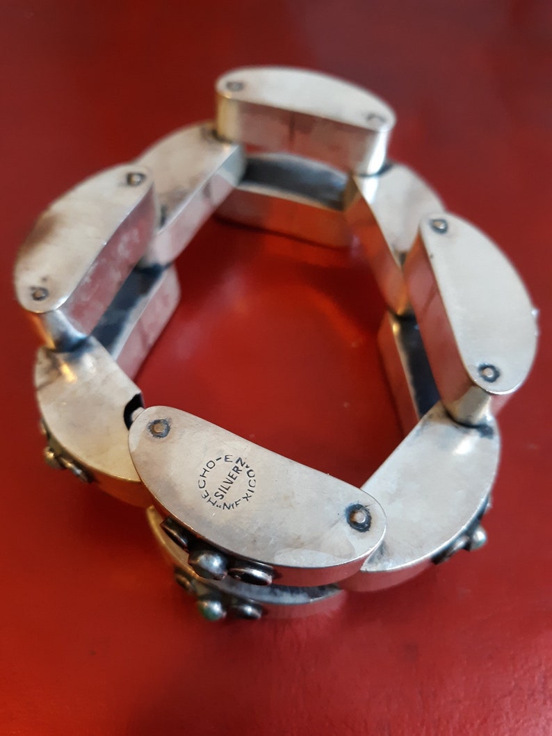 Hollow Geometric Silver Bracelet with Turquoise Accents is made in Mexico