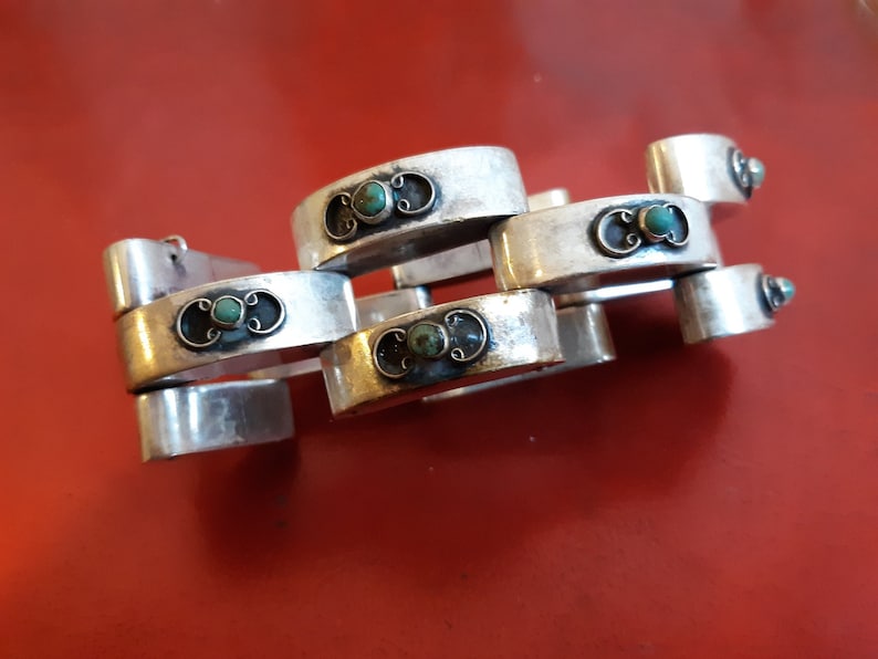 Hollow Geometric Silver Bracelet with Turquoise Accents is made in Mexico